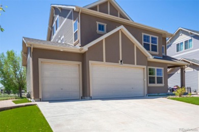 Welcome to this stunning two-story home that backs to Green on Green Valley Ranch Golf Club in Colorado - for sale on GolfHomes.com, golf home, golf lot