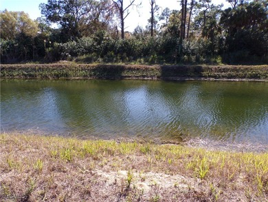 This Great waterfront lot is on the Fox canal providing a water on Lehigh Resort Club in Florida - for sale on GolfHomes.com, golf home, golf lot
