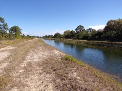 This Great waterfront lot is on the Fox canal providing a water on Lehigh Resort Club in Florida - for sale on GolfHomes.com, golf home, golf lot
