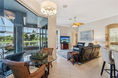 Step into a refined coastal retreat where panoramic lake views on Lely Resort Golf and Country Club in Florida - for sale on GolfHomes.com, golf home, golf lot