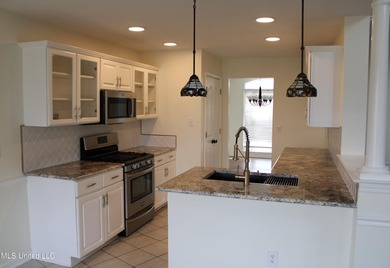 Nestled in the prestigious Plantation Subdivision, this stunning on The Plantation Golf Club in Mississippi - for sale on GolfHomes.com, golf home, golf lot