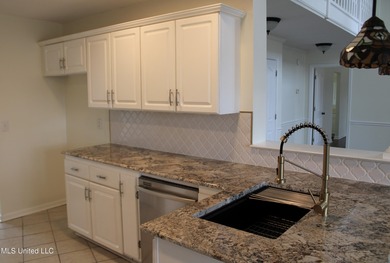 Nestled in the prestigious Plantation Subdivision, this stunning on The Plantation Golf Club in Mississippi - for sale on GolfHomes.com, golf home, golf lot