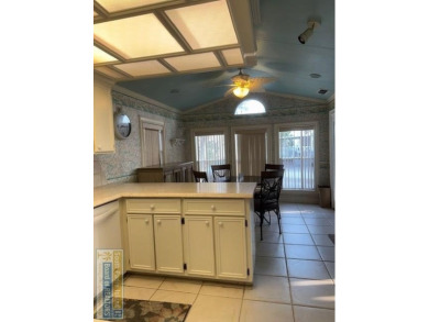This extremely spacious park model with island room has lots of on Long Island Golf Course in Texas - for sale on GolfHomes.com, golf home, golf lot