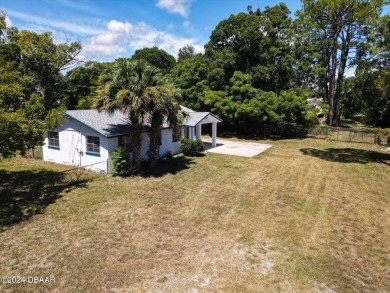 This beautifully remodeled 3/2 ranch style home with a one car on Daytona Beach Golf Club in Florida - for sale on GolfHomes.com, golf home, golf lot