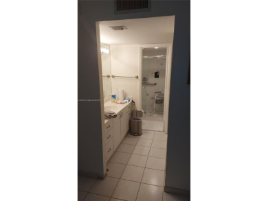 Don't miss this beautifully maintained ground floor corner unit on Pembroke Lakes Golf Club in Florida - for sale on GolfHomes.com, golf home, golf lot