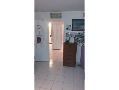 Don't miss this beautifully maintained ground floor corner unit on Pembroke Lakes Golf Club in Florida - for sale on GolfHomes.com, golf home, golf lot