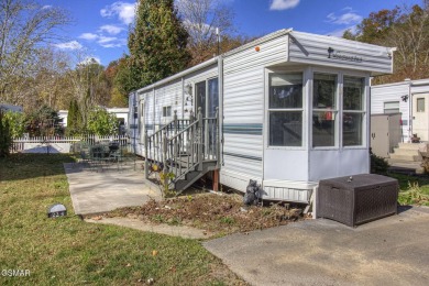 Situated right by the pool and within a short walk to the on Bent Creek Golf Course in Tennessee - for sale on GolfHomes.com, golf home, golf lot