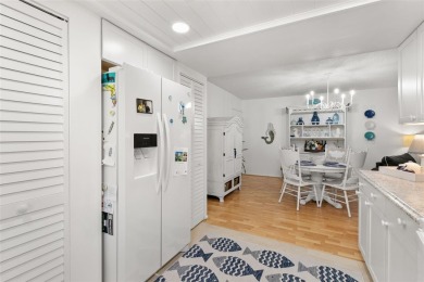 WELCOME TO THE GREEN DOLPHIN! This beautifully updated end-unit on Tarpon Springs Golf Course in Florida - for sale on GolfHomes.com, golf home, golf lot