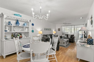WELCOME TO THE GREEN DOLPHIN! This beautifully updated end-unit on Tarpon Springs Golf Course in Florida - for sale on GolfHomes.com, golf home, golf lot