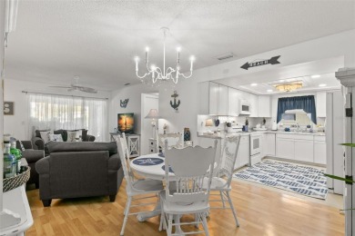 WELCOME TO THE GREEN DOLPHIN! This beautifully updated end-unit on Tarpon Springs Golf Course in Florida - for sale on GolfHomes.com, golf home, golf lot