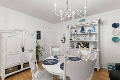WELCOME TO THE GREEN DOLPHIN! This beautifully updated end-unit on Tarpon Springs Golf Course in Florida - for sale on GolfHomes.com, golf home, golf lot