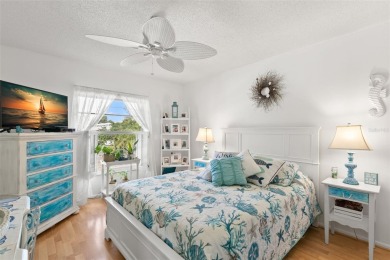 WELCOME TO THE GREEN DOLPHIN! This beautifully updated end-unit on Tarpon Springs Golf Course in Florida - for sale on GolfHomes.com, golf home, golf lot