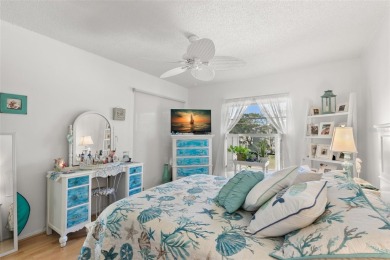 WELCOME TO THE GREEN DOLPHIN! This beautifully updated end-unit on Tarpon Springs Golf Course in Florida - for sale on GolfHomes.com, golf home, golf lot