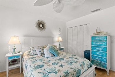 WELCOME TO THE GREEN DOLPHIN! This beautifully updated end-unit on Tarpon Springs Golf Course in Florida - for sale on GolfHomes.com, golf home, golf lot