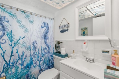 WELCOME TO THE GREEN DOLPHIN! This beautifully updated end-unit on Tarpon Springs Golf Course in Florida - for sale on GolfHomes.com, golf home, golf lot