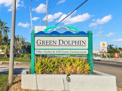 WELCOME TO THE GREEN DOLPHIN! This beautifully updated end-unit on Tarpon Springs Golf Course in Florida - for sale on GolfHomes.com, golf home, golf lot