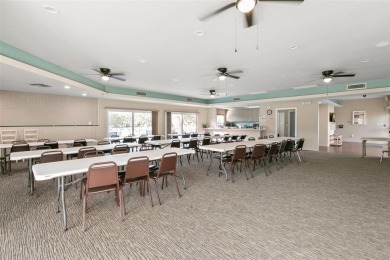 WELCOME TO THE GREEN DOLPHIN! This beautifully updated end-unit on Tarpon Springs Golf Course in Florida - for sale on GolfHomes.com, golf home, golf lot