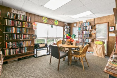 WELCOME TO THE GREEN DOLPHIN! This beautifully updated end-unit on Tarpon Springs Golf Course in Florida - for sale on GolfHomes.com, golf home, golf lot