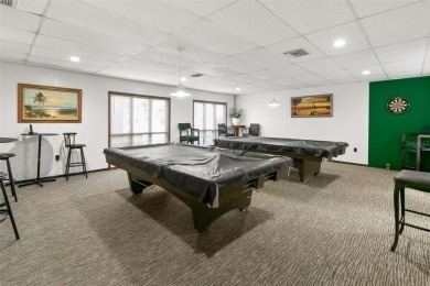 WELCOME TO THE GREEN DOLPHIN! This beautifully updated end-unit on Tarpon Springs Golf Course in Florida - for sale on GolfHomes.com, golf home, golf lot