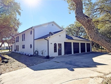 This classic-style 2-story residence is a statement of elegance on Rockport Country Club in Texas - for sale on GolfHomes.com, golf home, golf lot