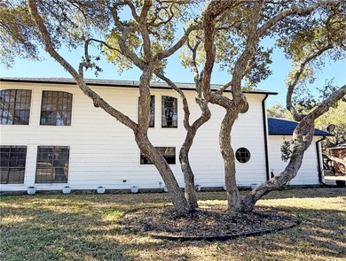 This classic-style 2-story residence is a statement of elegance on Rockport Country Club in Texas - for sale on GolfHomes.com, golf home, golf lot
