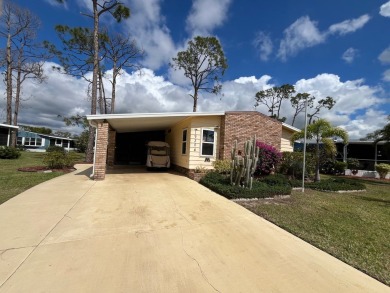 Discover this open-concept 2-bedroom, 2-bath home in the gated on Lake Fairways Country Club in Florida - for sale on GolfHomes.com, golf home, golf lot