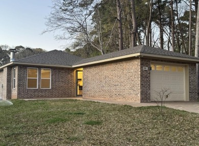 Welcome to 200 Leeward, this charming  2-bedroom, 2-bath brick for sale on GolfHomes.com