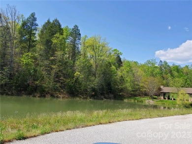 MOUNTAIN VIEWS GALORE ON LOT 21 IN TATANKA!  Perfect lot to on Rumbling Bald Resort on Lake Lure in North Carolina - for sale on GolfHomes.com, golf home, golf lot