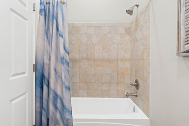 SPACIOUS HOME - RESORT-STYLE POOL - TWO INDOOR LIVING AREAS - on Santa Rosa Golf and Beach Club in Florida - for sale on GolfHomes.com, golf home, golf lot