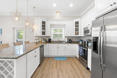 SPACIOUS HOME - RESORT-STYLE POOL - TWO INDOOR LIVING AREAS - on Santa Rosa Golf and Beach Club in Florida - for sale on GolfHomes.com, golf home, golf lot