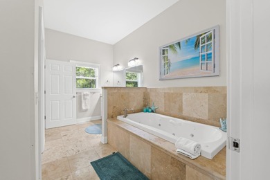 SPACIOUS HOME - RESORT-STYLE POOL - TWO INDOOR LIVING AREAS - on Santa Rosa Golf and Beach Club in Florida - for sale on GolfHomes.com, golf home, golf lot