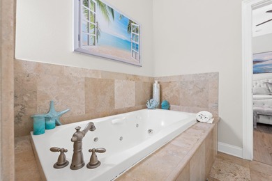 SPACIOUS HOME - RESORT-STYLE POOL - TWO INDOOR LIVING AREAS - on Santa Rosa Golf and Beach Club in Florida - for sale on GolfHomes.com, golf home, golf lot