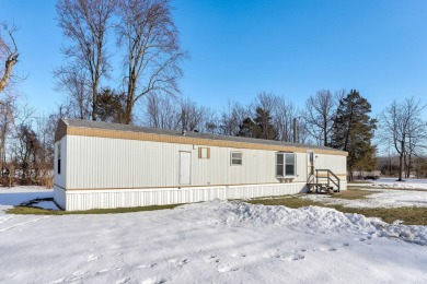 Looking for affordable country living? This charming 2-bedroom on Beeches Golf Club  in Michigan - for sale on GolfHomes.com, golf home, golf lot