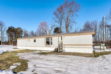 Looking for affordable country living? This charming 2-bedroom on Beeches Golf Club  in Michigan - for sale on GolfHomes.com, golf home, golf lot