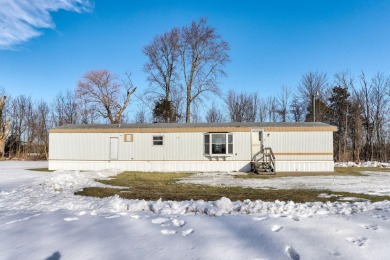 Looking for affordable country living? This charming 2-bedroom on Beeches Golf Club  in Michigan - for sale on GolfHomes.com, golf home, golf lot