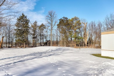 Looking for affordable country living? This charming 2-bedroom on Beeches Golf Club  in Michigan - for sale on GolfHomes.com, golf home, golf lot