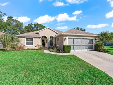 This beautifully maintained concrete block and stucco 'Doral' on Royal Oaks Golf Club in Florida - for sale on GolfHomes.com, golf home, golf lot
