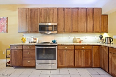 This is a must see Condo ~ tastefully updated, meticulously on Cypress Lake Country Club in Florida - for sale on GolfHomes.com, golf home, golf lot