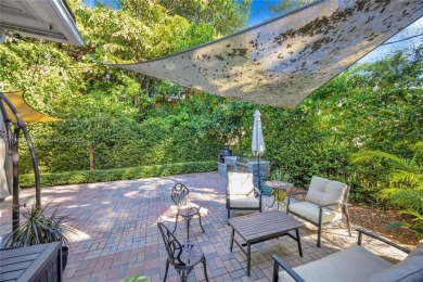 Nestled in the desirable streets of North Gables, this charming on Granada Golf Club in Florida - for sale on GolfHomes.com, golf home, golf lot