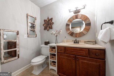 Beautifully situated on a peaceful 1.2 acre lot in one of on North Fulton Golf Course in Georgia - for sale on GolfHomes.com, golf home, golf lot