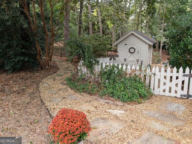 Beautifully situated on a peaceful 1.2 acre lot in one of on North Fulton Golf Course in Georgia - for sale on GolfHomes.com, golf home, golf lot