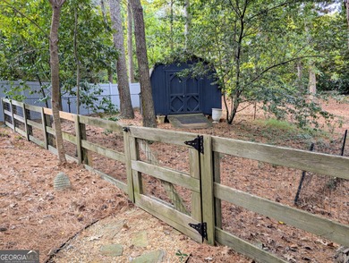 Beautifully situated on a peaceful 1.2 acre lot in one of on North Fulton Golf Course in Georgia - for sale on GolfHomes.com, golf home, golf lot