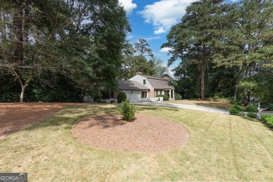 Beautifully situated on a peaceful 1.2 acre lot in one of on North Fulton Golf Course in Georgia - for sale on GolfHomes.com, golf home, golf lot