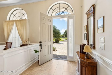 Stunning Amelia National home on a premier lot tucked into a on Amelia National Golf and Country Club in Florida - for sale on GolfHomes.com, golf home, golf lot