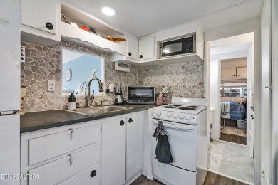 This lovely home on a one and a half lot provides ample privacy on Lake Tansi Village Country Club in Tennessee - for sale on GolfHomes.com, golf home, golf lot