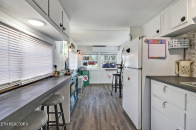 This lovely home on a one and a half lot provides ample privacy on Lake Tansi Village Country Club in Tennessee - for sale on GolfHomes.com, golf home, golf lot