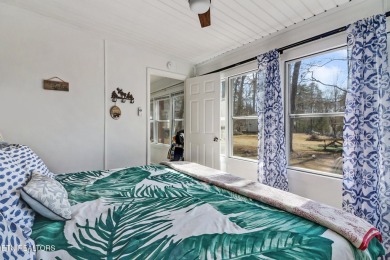 This lovely home on a one and a half lot provides ample privacy on Lake Tansi Village Country Club in Tennessee - for sale on GolfHomes.com, golf home, golf lot