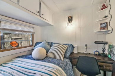 This lovely home on a one and a half lot provides ample privacy on Lake Tansi Village Country Club in Tennessee - for sale on GolfHomes.com, golf home, golf lot