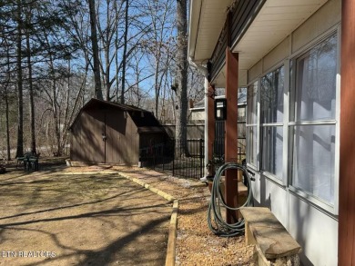 This lovely home on a one and a half lot provides ample privacy on Lake Tansi Village Country Club in Tennessee - for sale on GolfHomes.com, golf home, golf lot