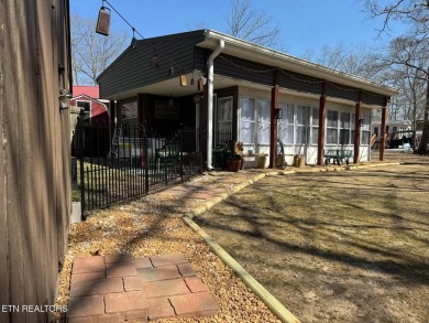 This lovely home on a one and a half lot provides ample privacy on Lake Tansi Village Country Club in Tennessee - for sale on GolfHomes.com, golf home, golf lot